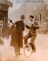 PC giving directions to a mono-cyclist, Hammersmith, c.1935