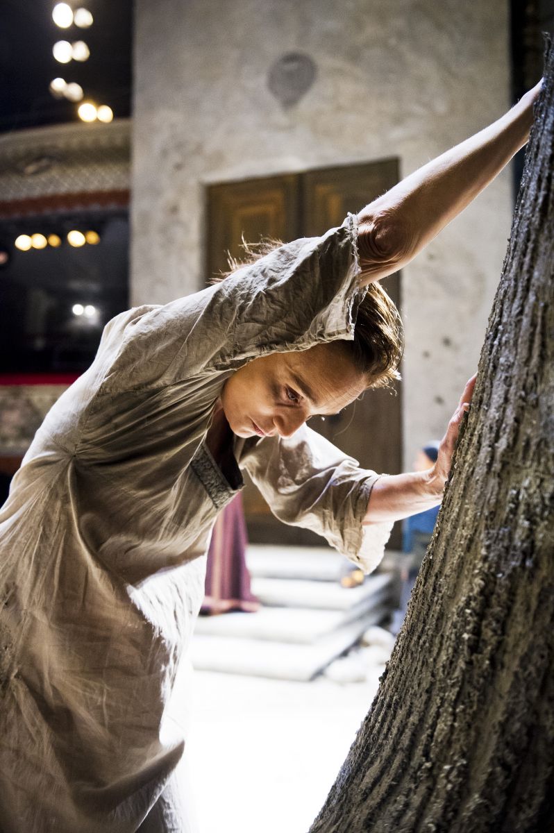 The setting, showing the imposing doors and the tree trunk. Kristin Scott Thomas as Electra