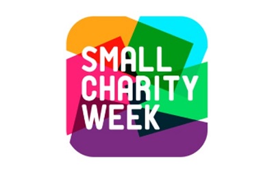 Photo of the Small Charity week logo which is brightly coloured with splashes of yellow, red, pink, green, blue and purple