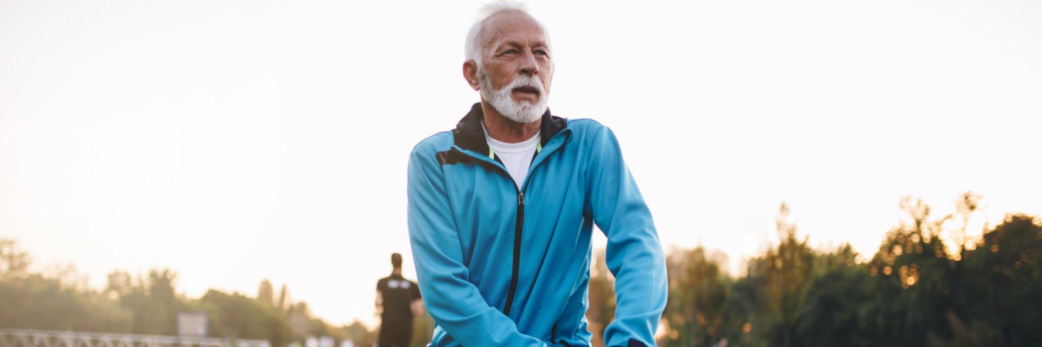 Older man warming up for exercise