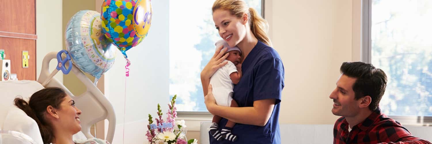 Nurse with a baby and parents