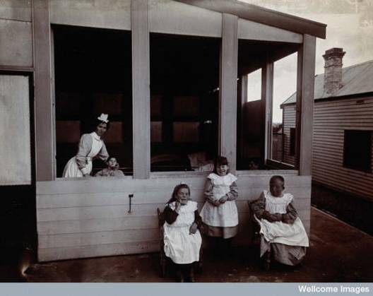  children with their nurse in the summer house