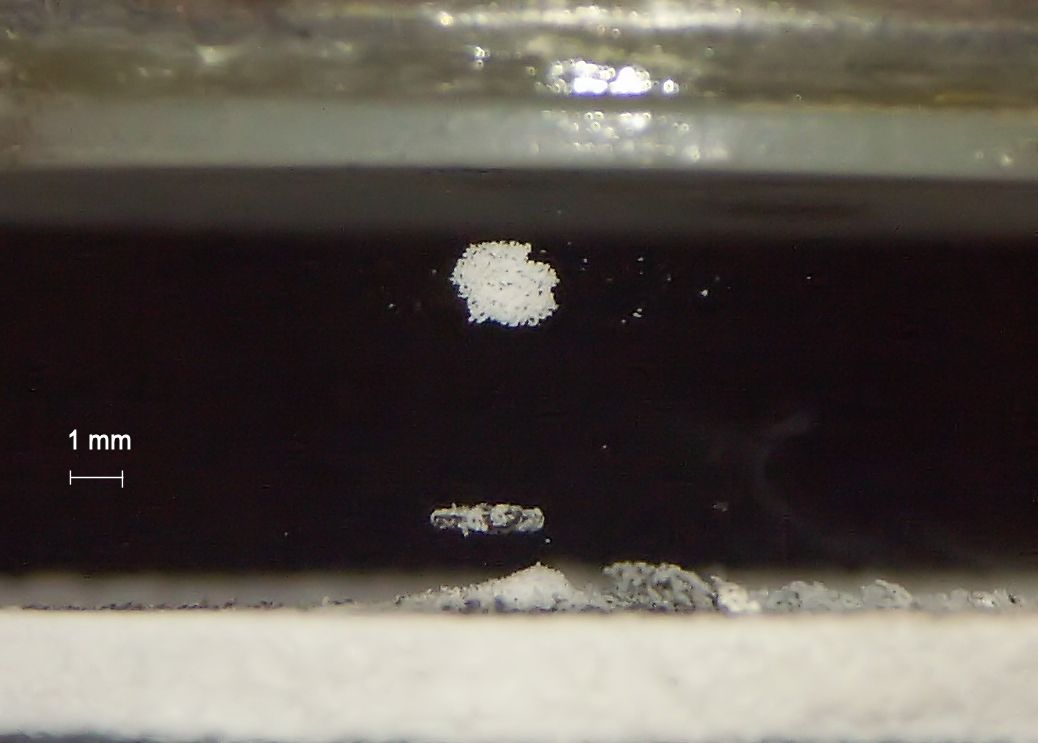 Acoustically levitated icy soot aggregates