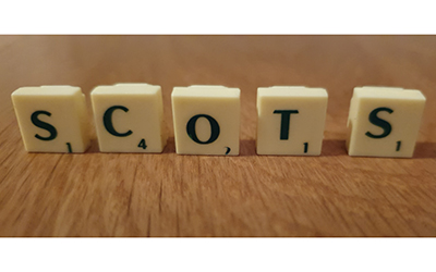  Scrabble pieces spelling the word 'Scots'