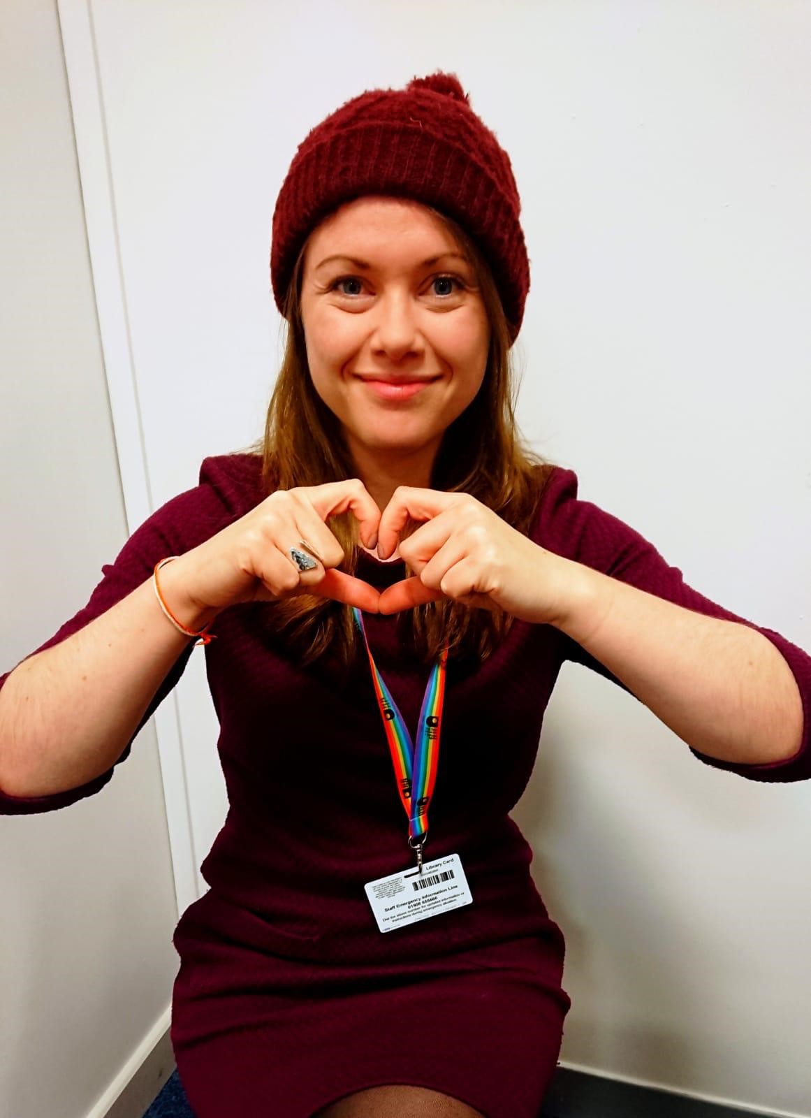 OU careers consultant Penny wearing red beanie