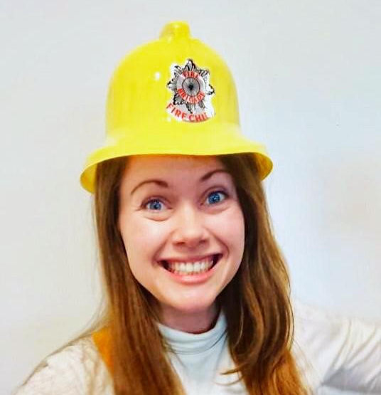 OU careers consultant Penny wearing yellow fire hat