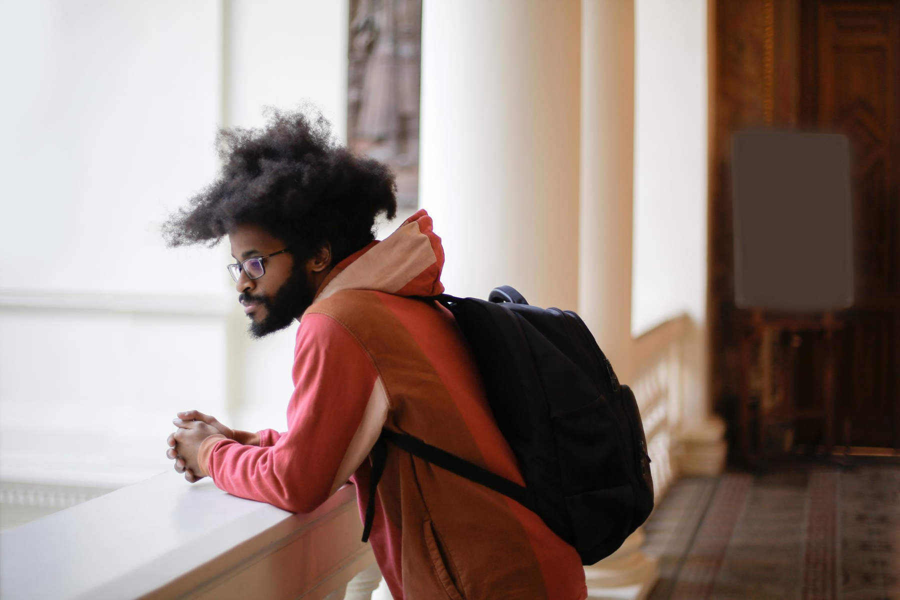 Student resting on a windowsill