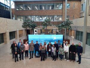 A group of OU students in front of a building at Alderley Park