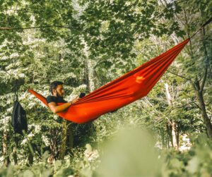 Student reading in a hammock