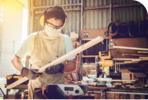 Image of a man doing woodwork.