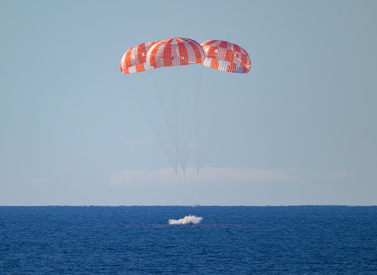 The Orion spacecraft splashes down in the Pacific.