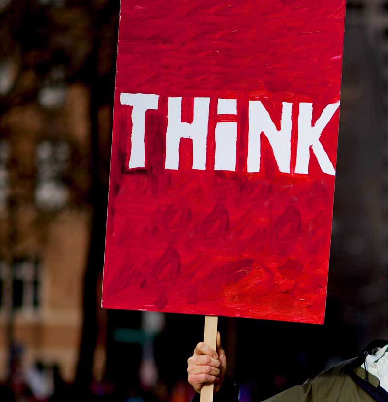 Photo of a sign saying 'THINK'