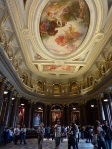 A richly painted ceiling in a large hall