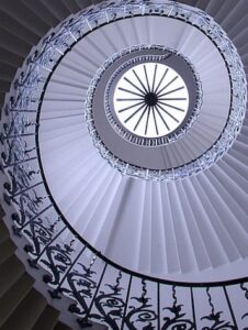 Spiral staircase with tulip shaped iron bannisters