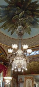 Dragon chandelier with leaves behind.