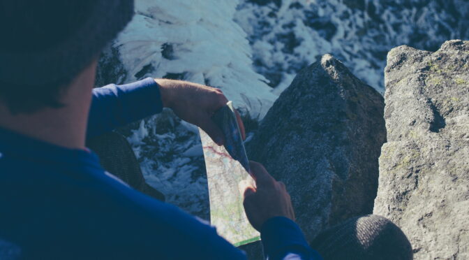 Image of hiker reading a map