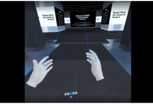 screen capture of the view of the working space from Mike's VR headset. We see a pair of hands directing us to places within the virtual working space.