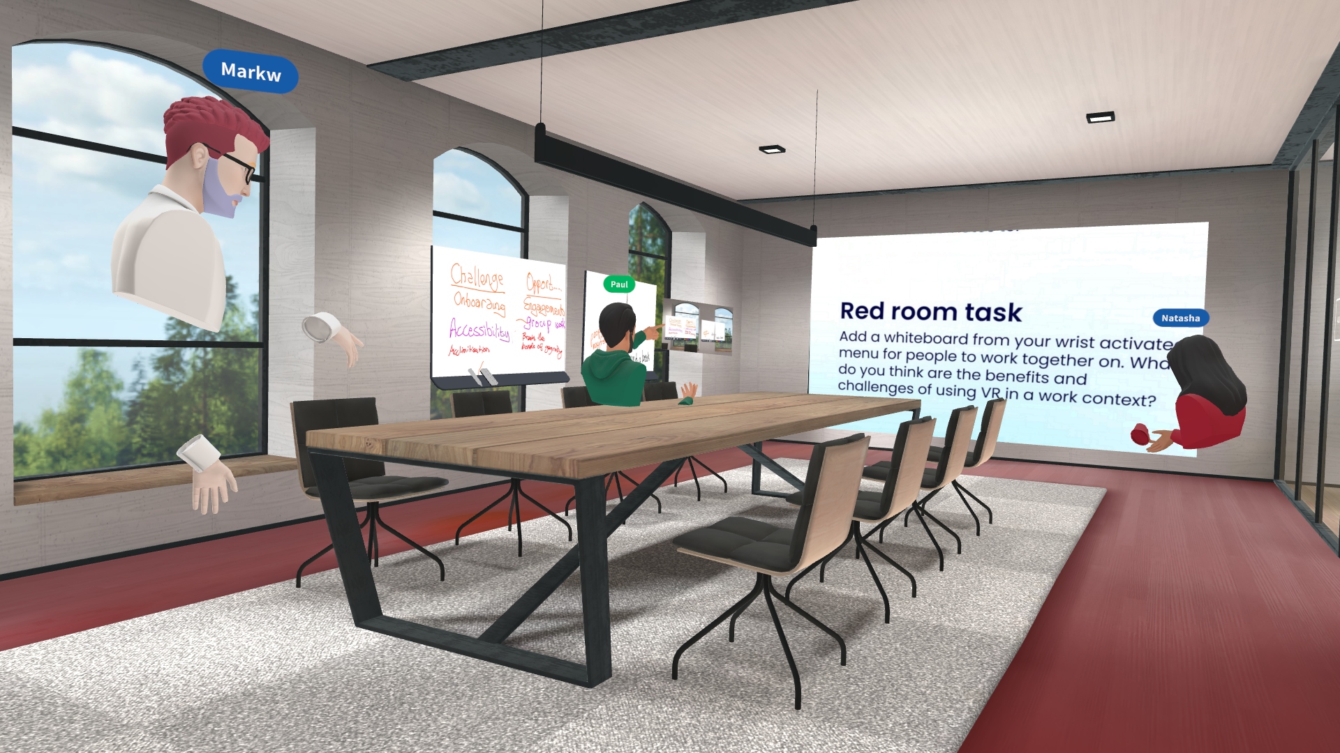 Image from a VR application showing three avatars all working in a meeting room with three large windows. There is a long table in the middle. A slide on a screen at the front of the room reads 'Red room task'.