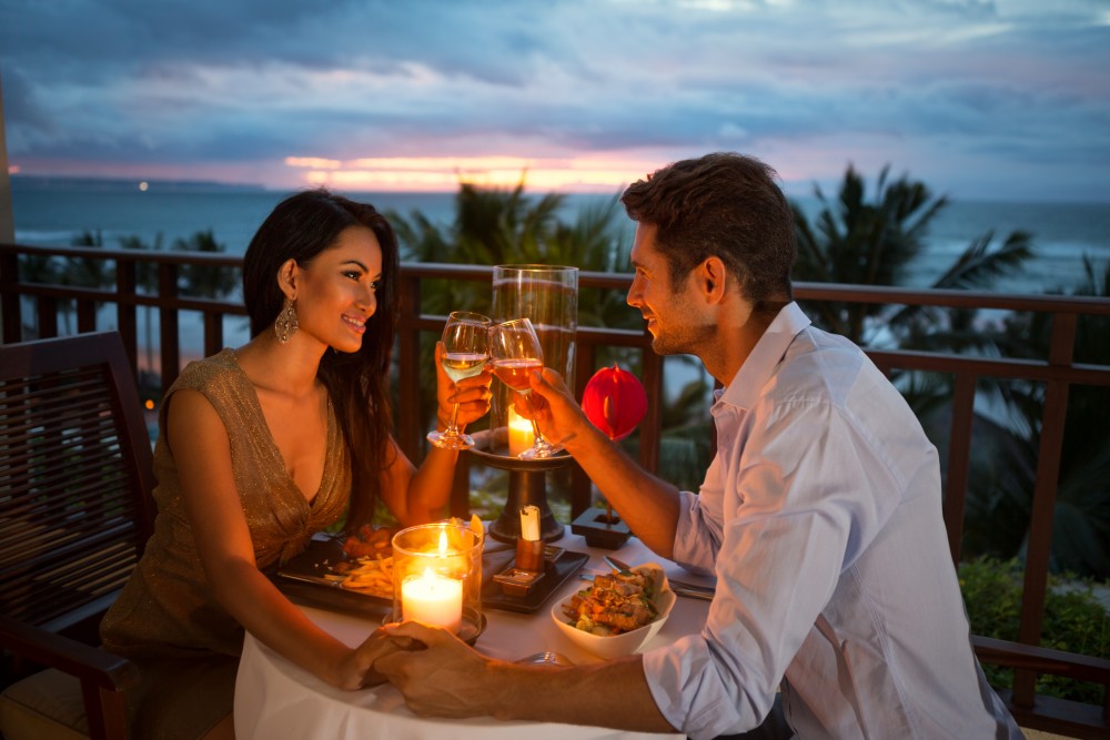 couple enjoying a romantic dinner by candlelight. Image credit: Thinkstock