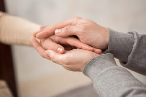 Picture of someone holding another person's hand