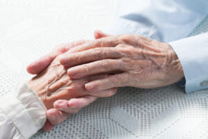 Older couple holding hands