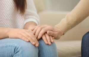 Man comforting woman