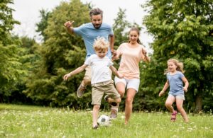 Active family play soccer in their leisure time