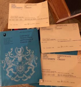Wilfred's credit certificates and degree ceremony brochure