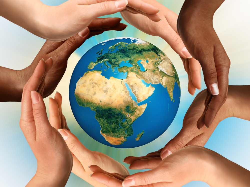 Hands surrounding a globe