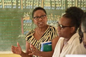 Alicia Herbert OBE, FCDO Director of Education, Gender and Equality and Loyce Nhandara, SAGE District Coordinator