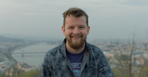 Image of white male with coastal background