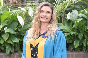 Photo of Emily Hollis in her graduation robes