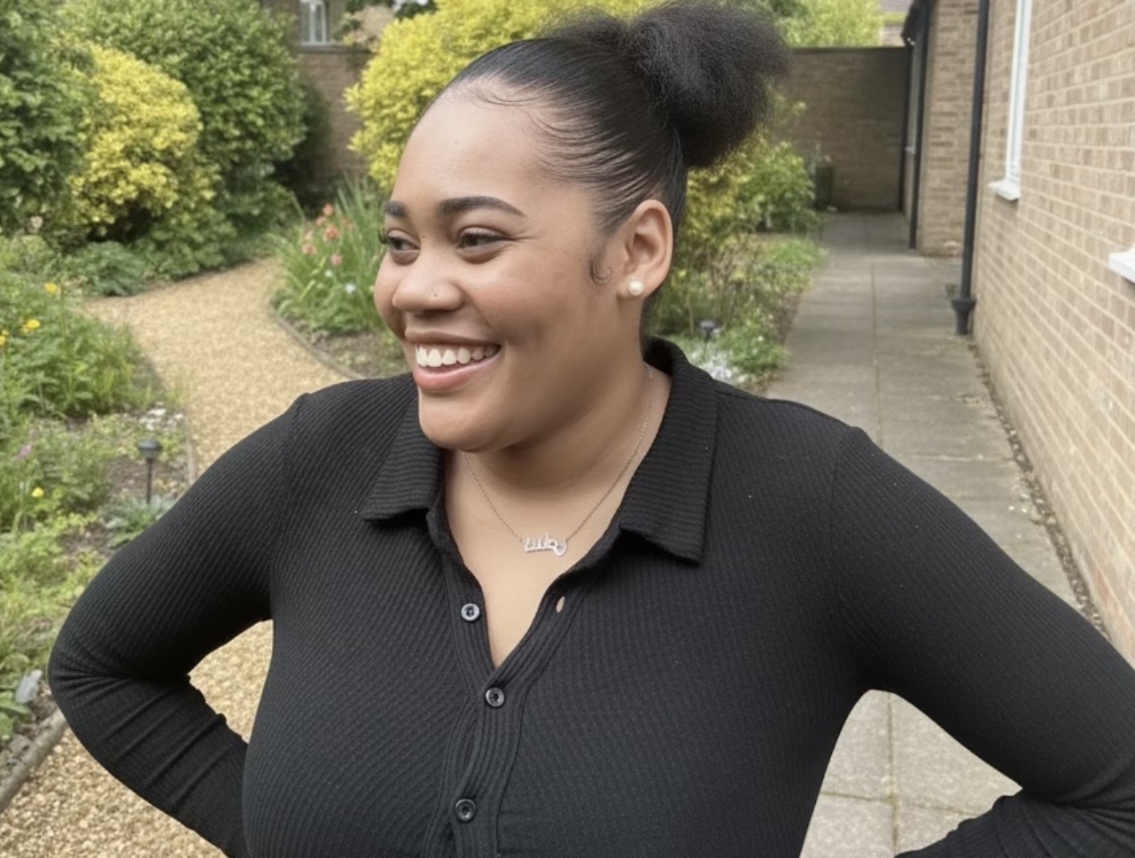 Photo of Open University Law graduate Sade smiling