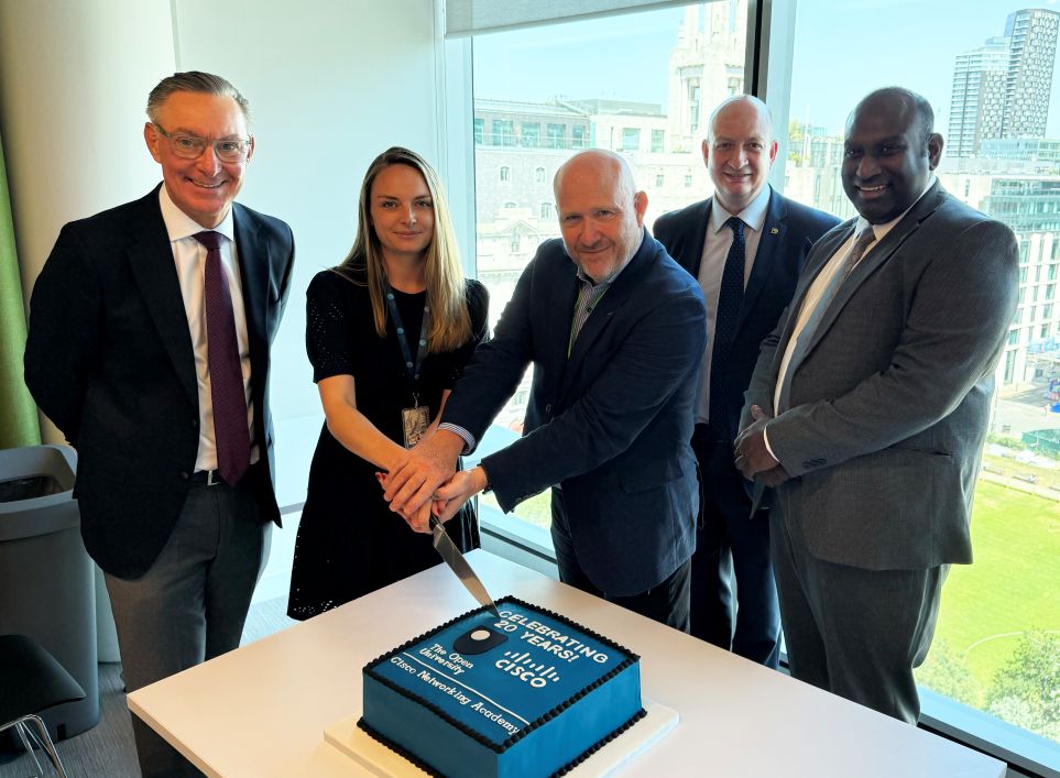 Representatives of Cisco and The Open University cutting a cake to celebrate the 20th anniversary of the partnership between the OU and Cisco.