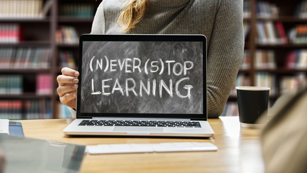 Laptop screen displaying the words Never Stop Learning in capital letters. Copyright Geralt on Pixabay