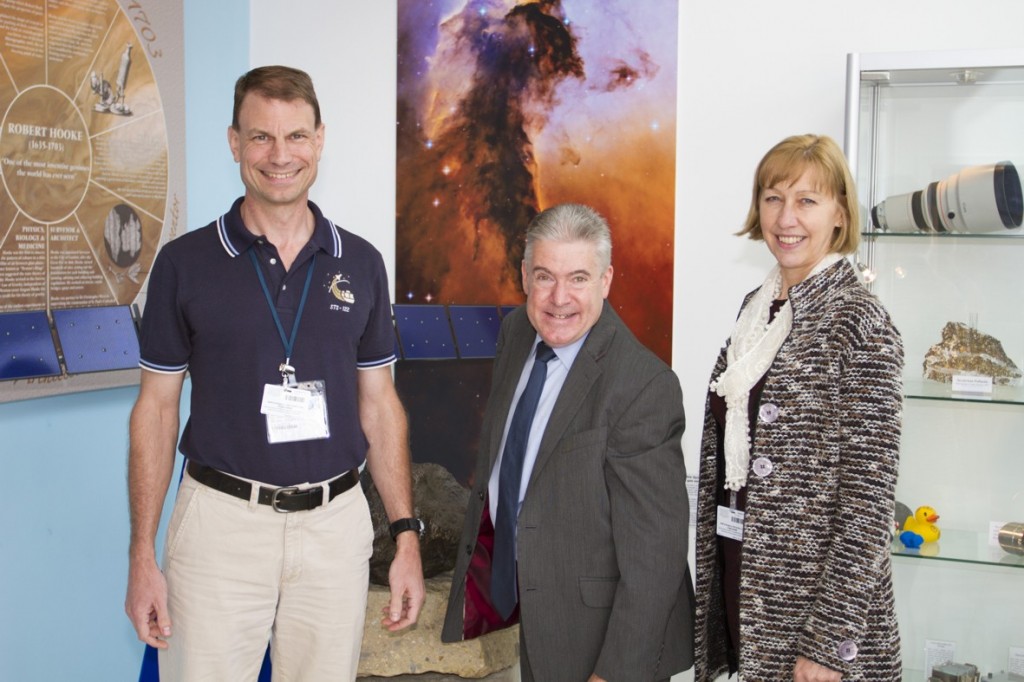 NASA astronaut Dr. Stanley G. Love, Vice Chancellor of the OU Martin Bean, and Prof. Hazel Rymer, Dean of the Faculty of Science in front of spaceflight instruments and models in the OU’s Robert Hooke building. Image credit: Luke Beaman, OU.