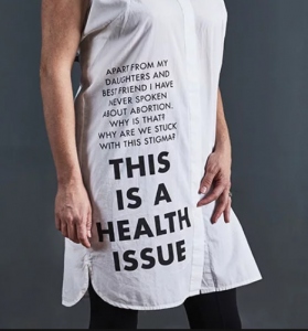 This is a health issue; stories are printed on items of clothing, in this case a T-shirt.