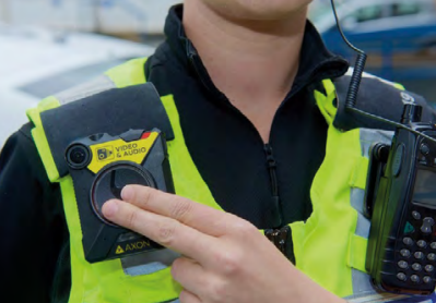 Police officer covering lens of body worn camera
