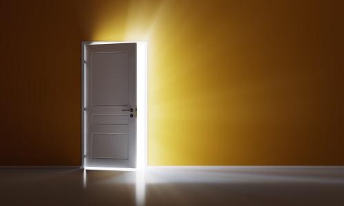 open door with a yellow light