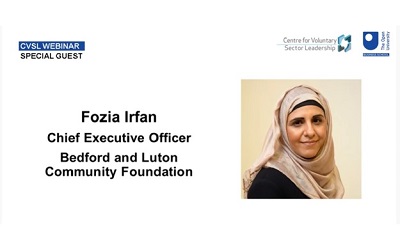 Photo shows the opening slide of Fozia's presentation. It shows her smiling at the camera wearing a cream hijab
