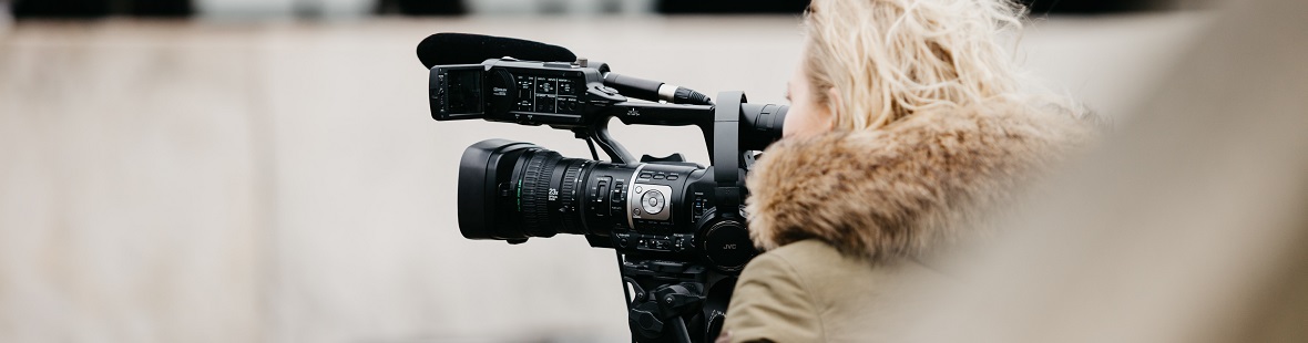 Woman with a filming camera outdoors CREDIT Joppe Spaa on Unsplash