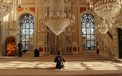  Visitors to a sacred religious building pray in Turkey