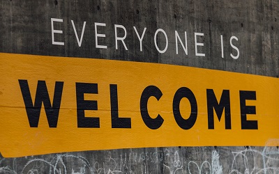 A sign reads "Everyone is welcome"