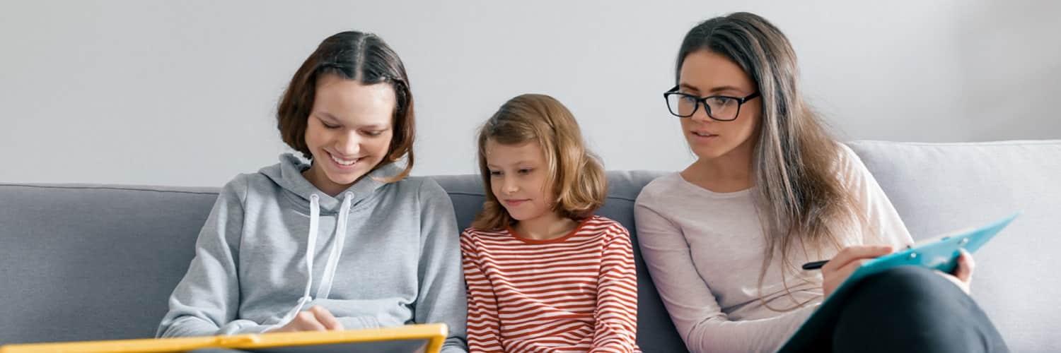 Counsellor with two young girls