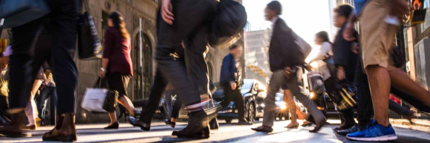 Urban scene of people crossing a city street