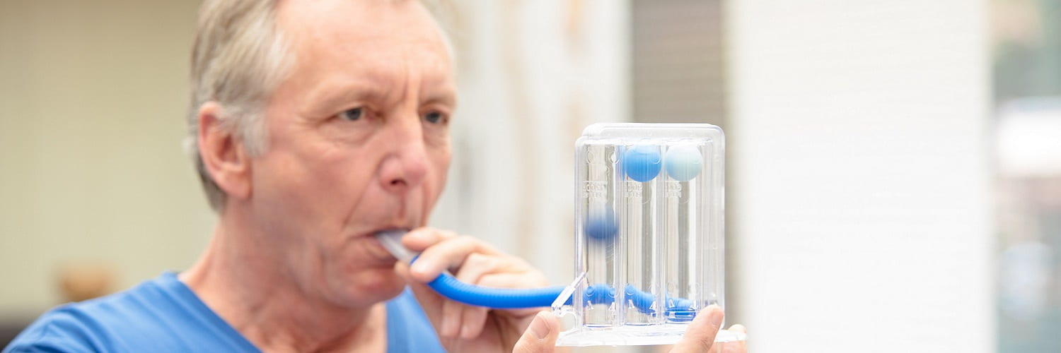 Patient taking a lung function test