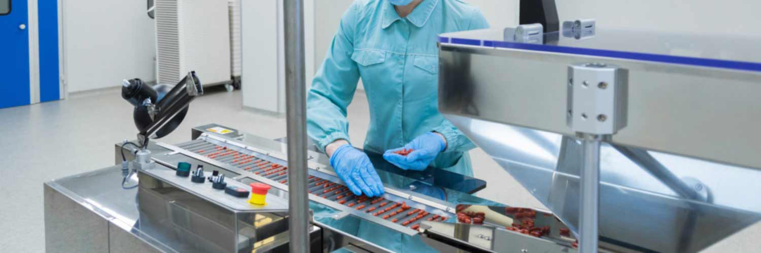 Factory worker in a pharmaceutical production line