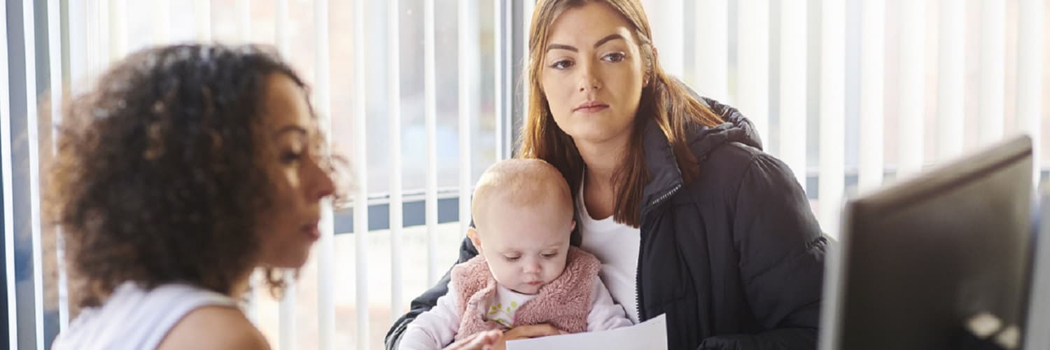 Mother and her baby visiting a healthcare worker