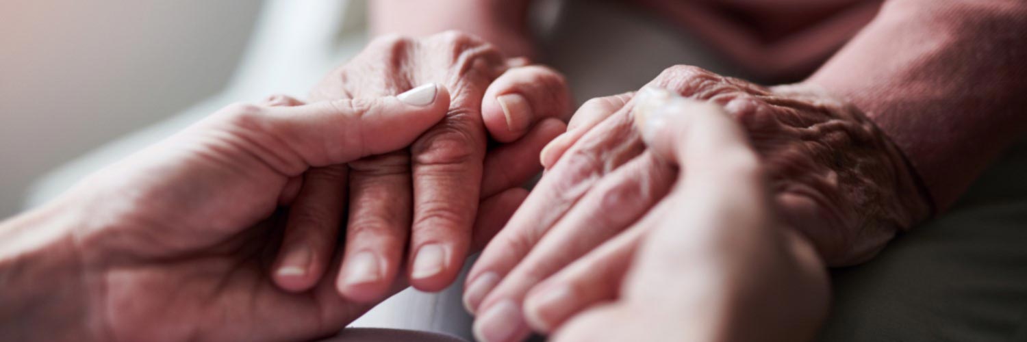 Close up of two people holding hands