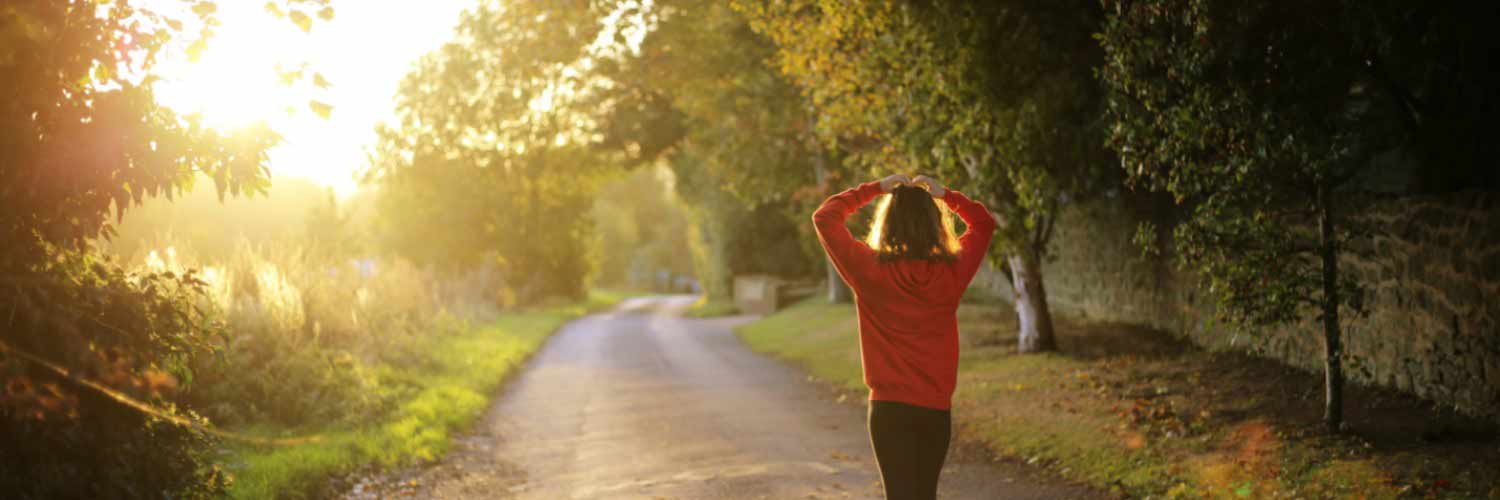 Two women work out in morning sunshine